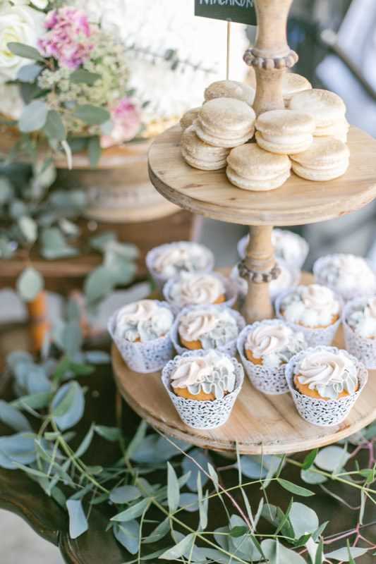 wedding dessert table vanilla cake cupcake french macaroons vintage shabby chic barn