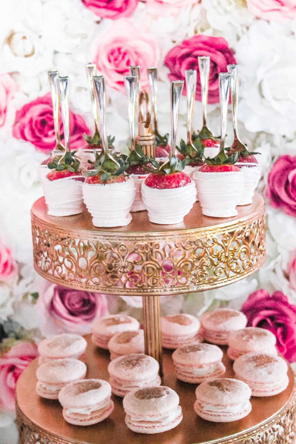 pink rose gold dipped strawberries french macarons dessert table